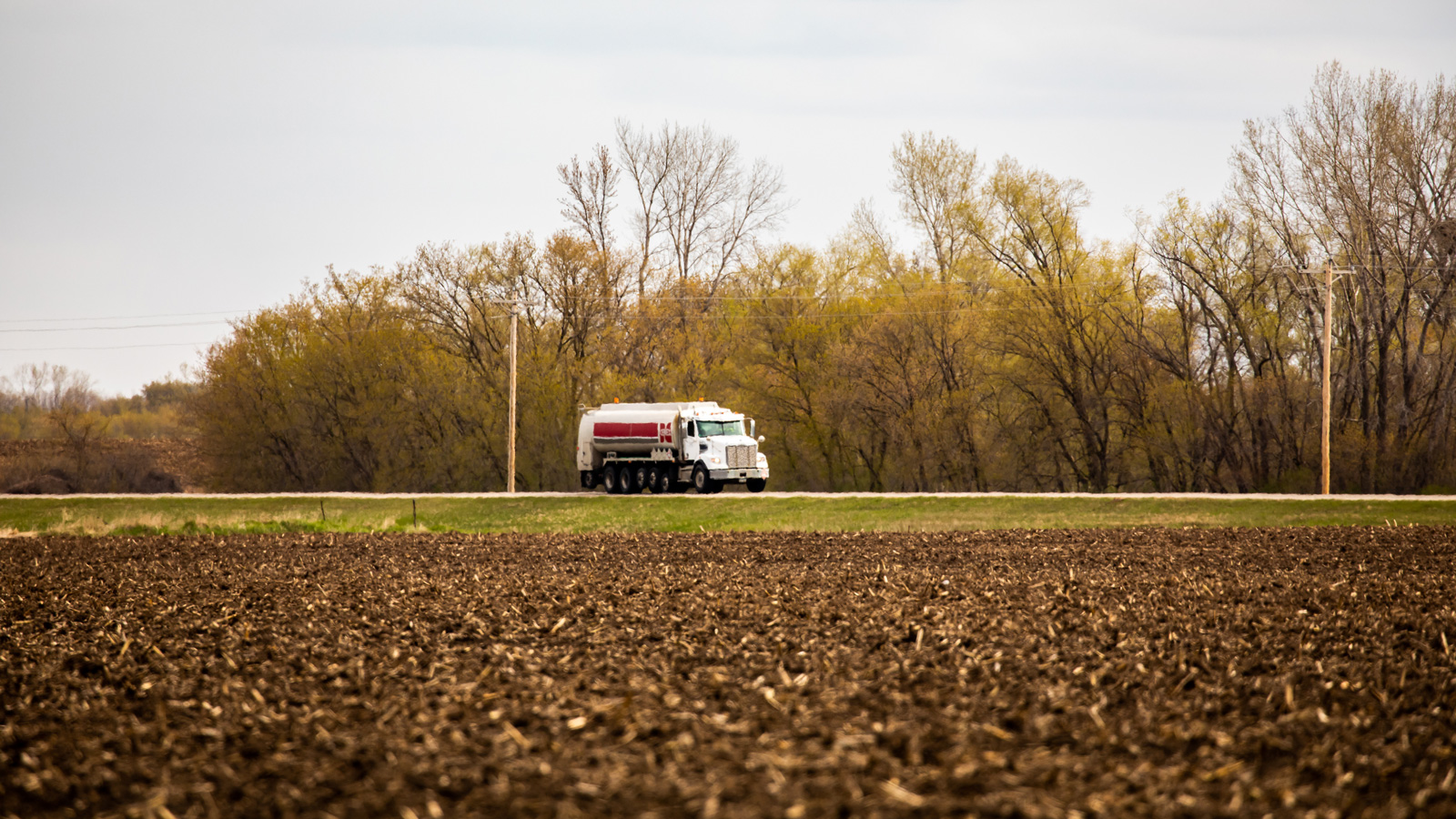 Cenex propane truck driving down a country road